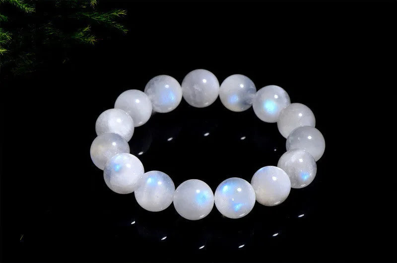 Natural white moonstone round bead bracelet showing blue moonlight sheen and polished surface