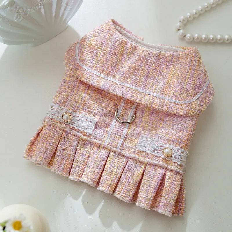Purple or pink polyester pet clothing for a small dog or cat, showing size options S, M, L, XL.