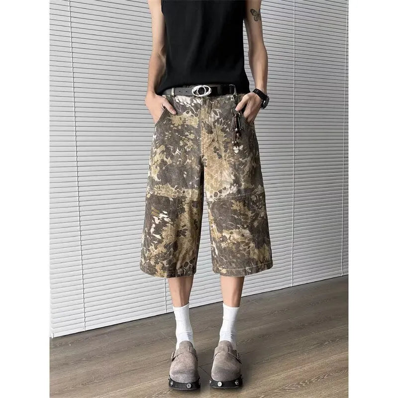 Yellow women's jeans with snake camouflage print, cropped length, and high waist.