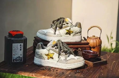 Green casual shoes with star pattern, mesh lining, thick rubber sole, and lace-up closure