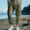 Men's ankle-tied casual trousers in linen fabric with multi-pocket design and drawstring waist