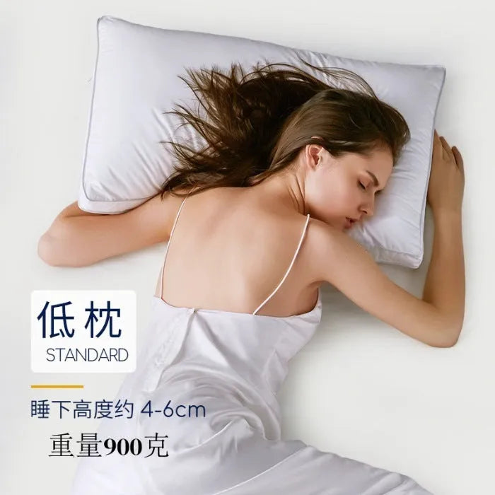 White cotton satin stripe feather and cotton pillow showing three size options
