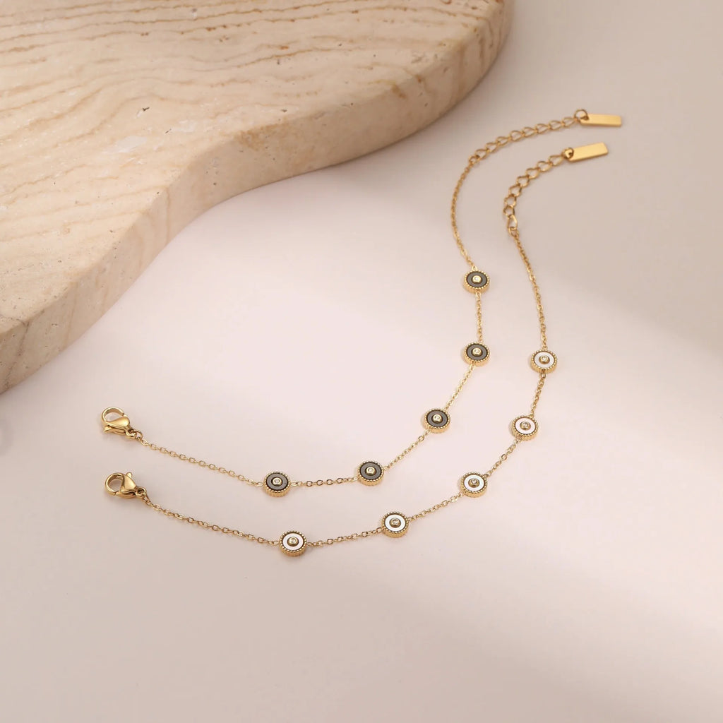 Geometric design women's jewellery set with bracelet and necklace in gold-plated stainless steel