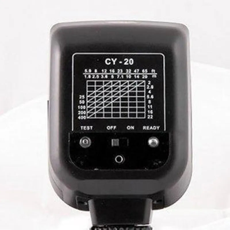 Compact black SLR camera flash with tilted head mounted on a DSLR camera hot shoe.