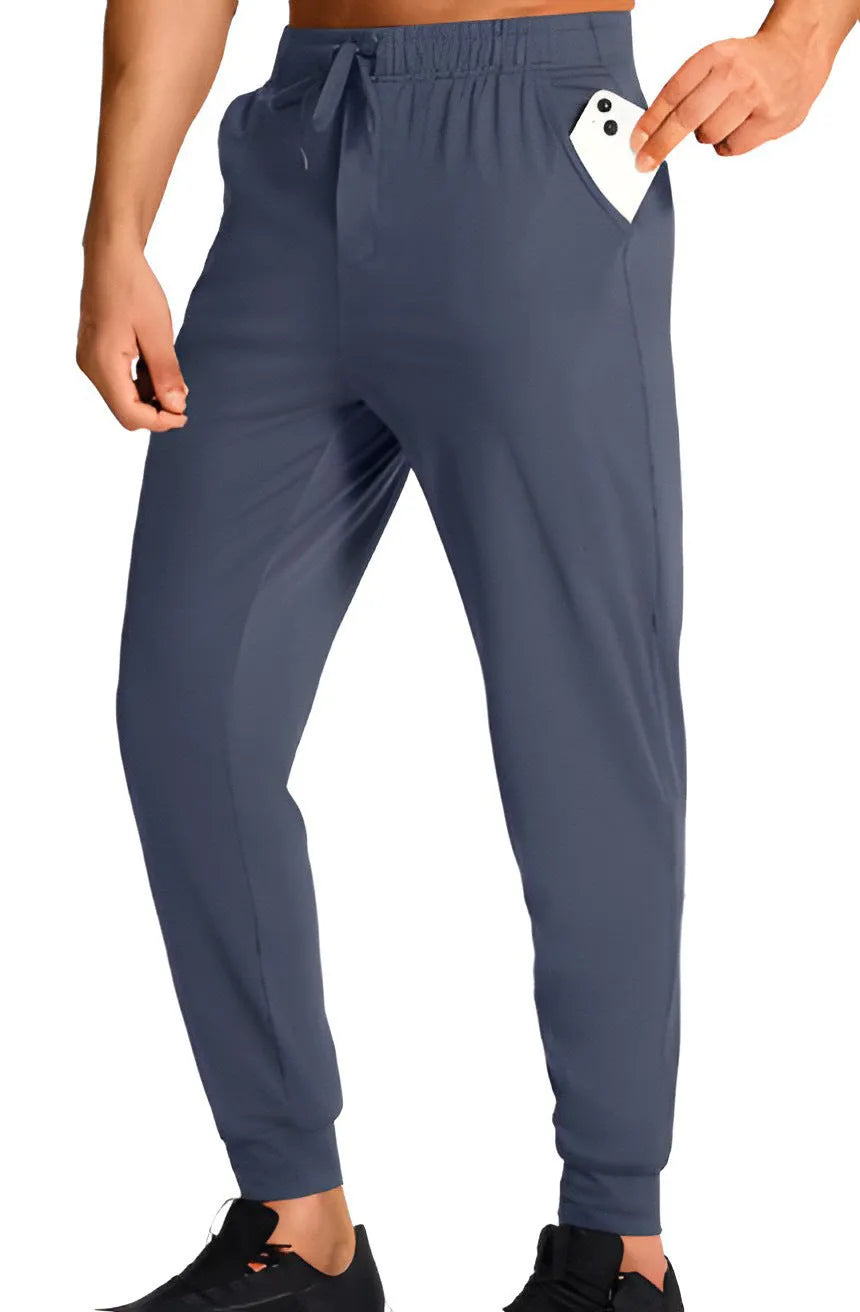 Men's loose fit solid colour casual trousers in polyester, shown in one of thirteen available colour options.