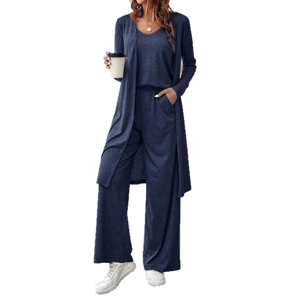 Blue women's three-piece casual suit set comprising sling top, long cardigan, and trousers on a hanger.