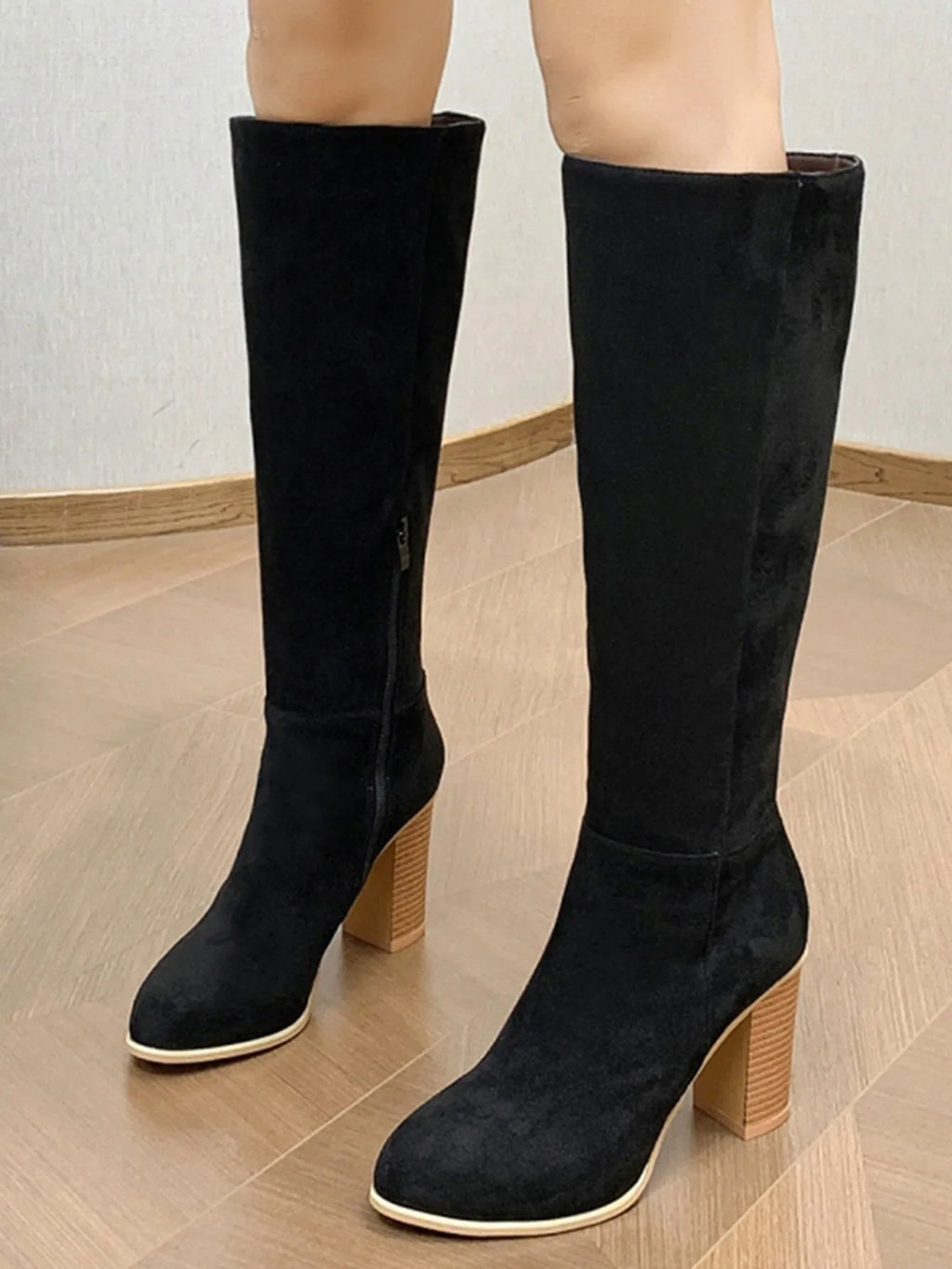 Women's black square toe high heel fashion boots made from artificial PU material.