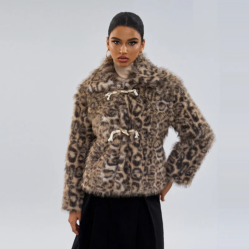 Female leopard print coat with a silver buckle detail on the lapel.