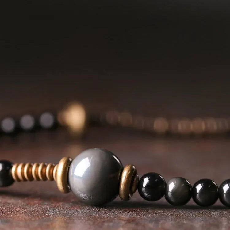 Black multi-layered bracelet with colourful geometric beads in retro design