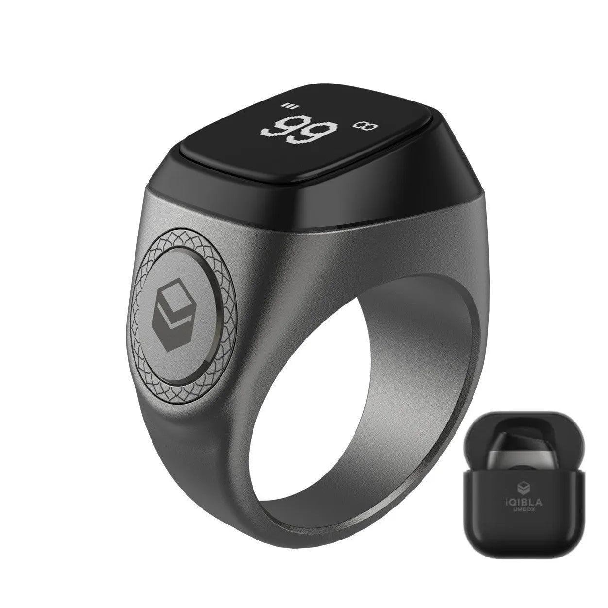 Silver smart ring with a small OLED display showing prayer count, next to its USB charging case.