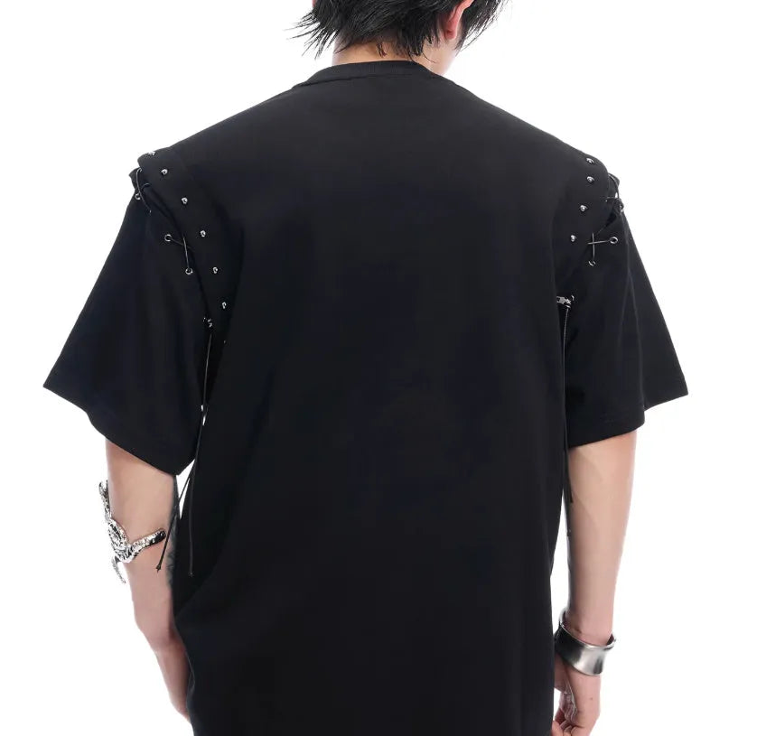 Black deconstructed lace-up cutout short sleeve t-shirt on a hanger