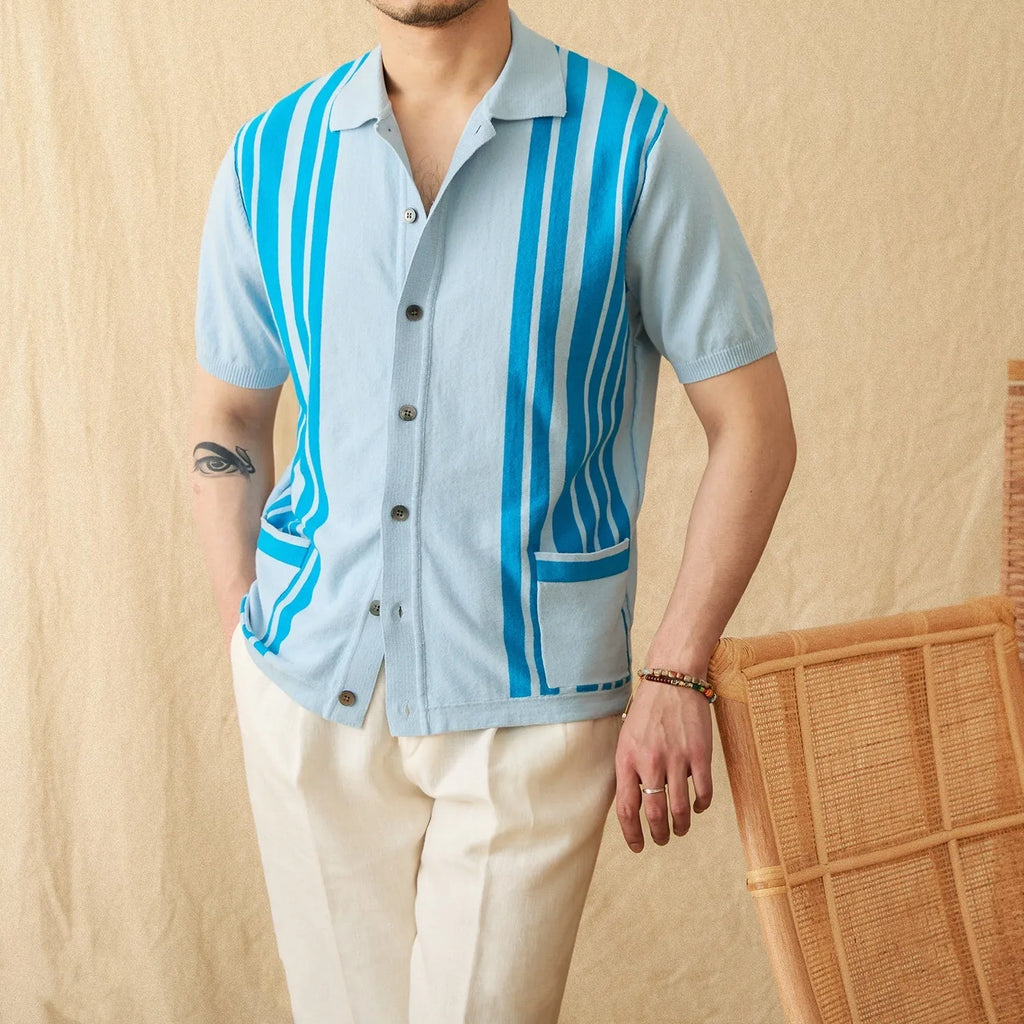 Man wearing a royal blue striped short-sleeved polo cardigan with a lapel collar.