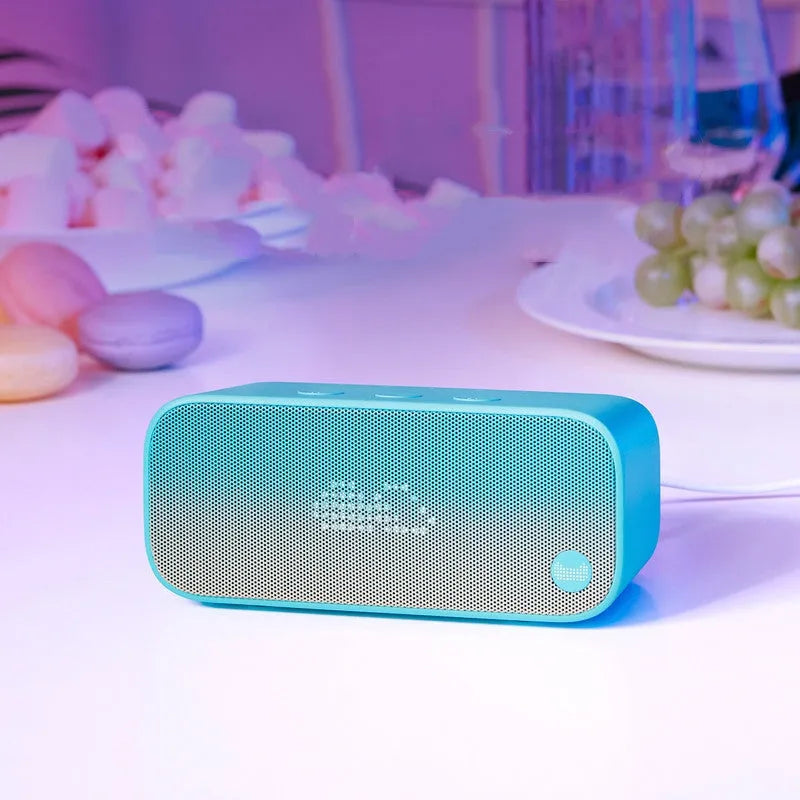 Elf sugar cube artificial intelligence smart WiFi speaker in blue, green, red, or white colours with front-facing bookshelf design