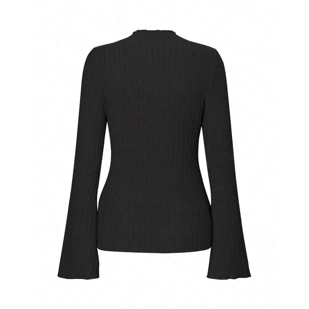 Man wearing a slim-fit long sleeve black top with a subtle brushed stripe texture and round neck.