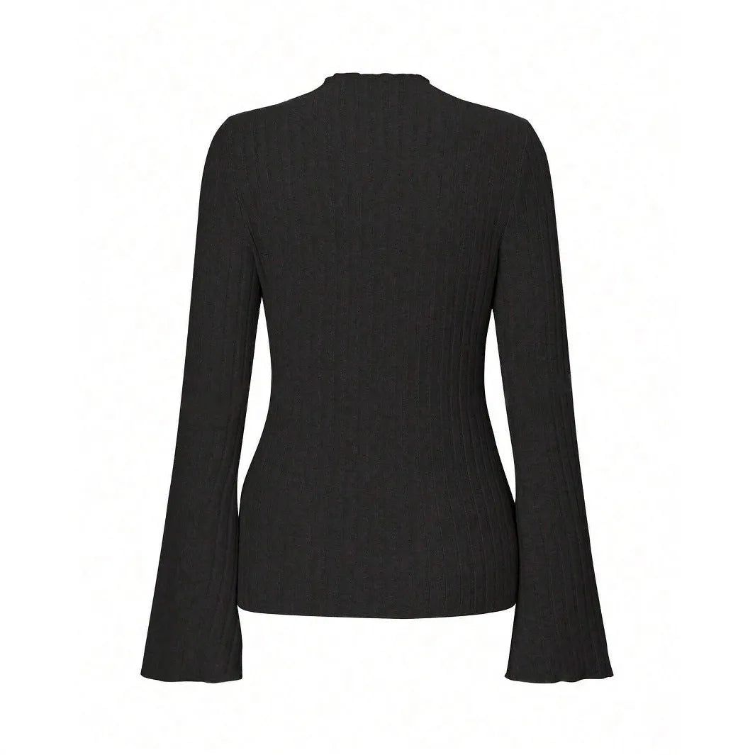 Man wearing a slim-fit long sleeve black top with a subtle brushed stripe texture and round neck.