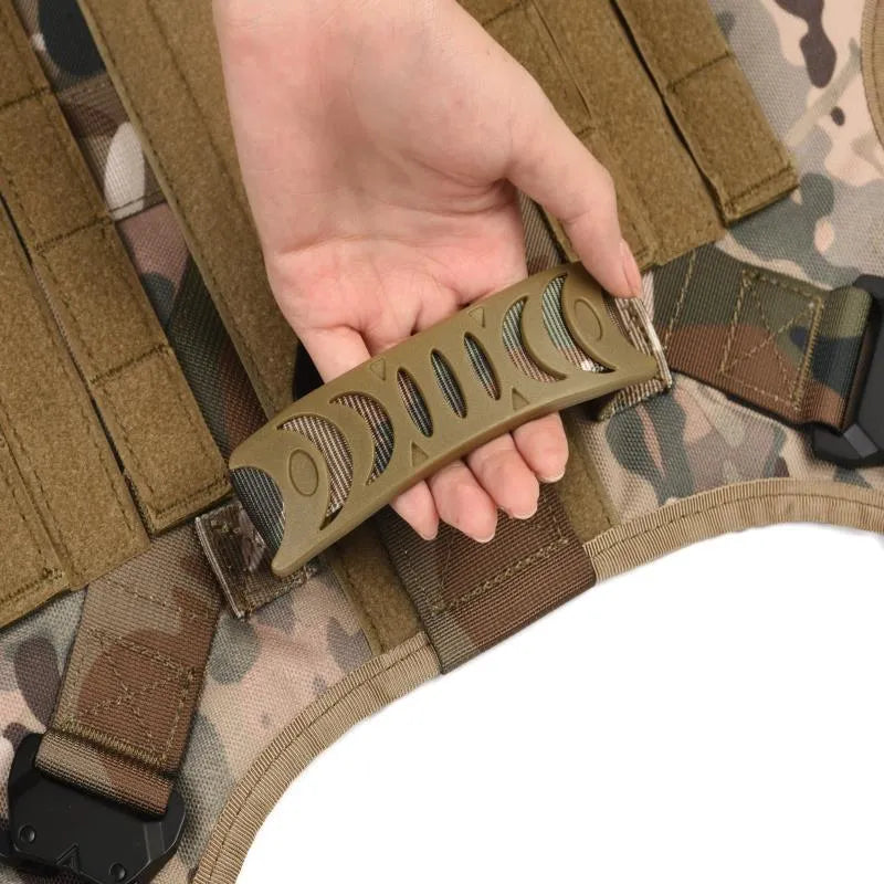 Dog wearing combat vest training gear with chain ring and rope components