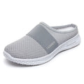 Women's flat casual shoes in mesh fabric with hollow-out design on a round toe.