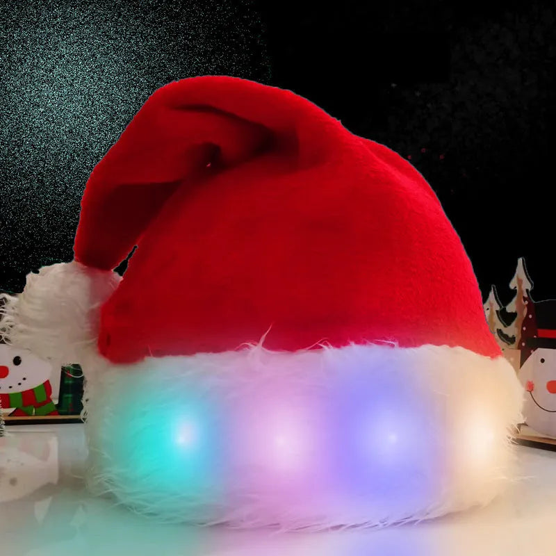 Red and white plush LED Santa hat with pom-pom and 20 multi-colour lights illuminated.