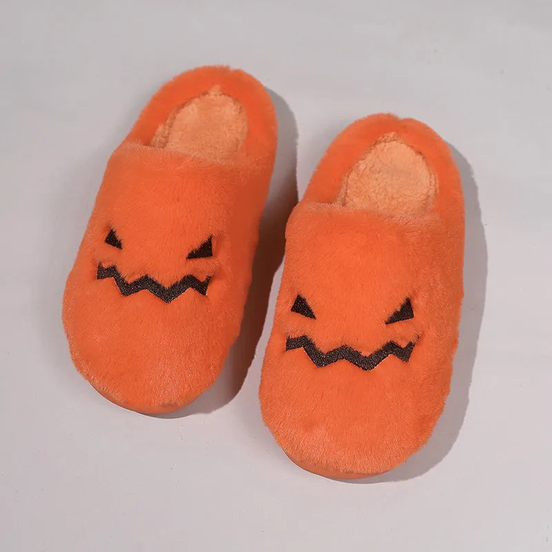 Orange Halloween pumpkin design plush slippers with a non-slip sole.