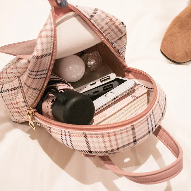 A one shoulder diagonal phone bag in PU fabric, shown in one of five colour options.