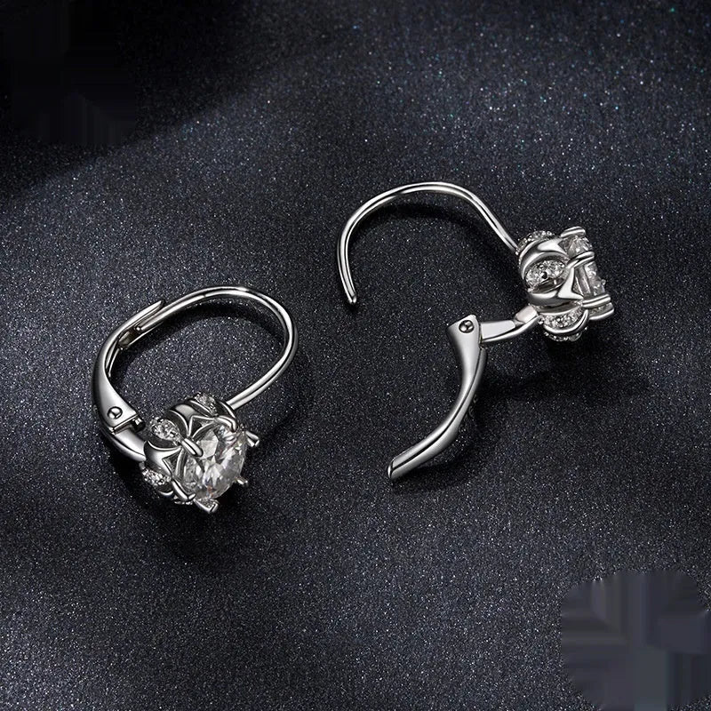 White gold plated sterling silver flower bud clip earrings with a moissanite centre stone