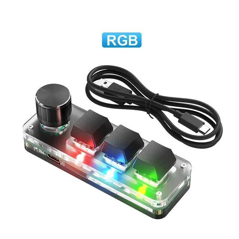 Black and white macro keypad mini keyboard with RGB backlit keys on a desk