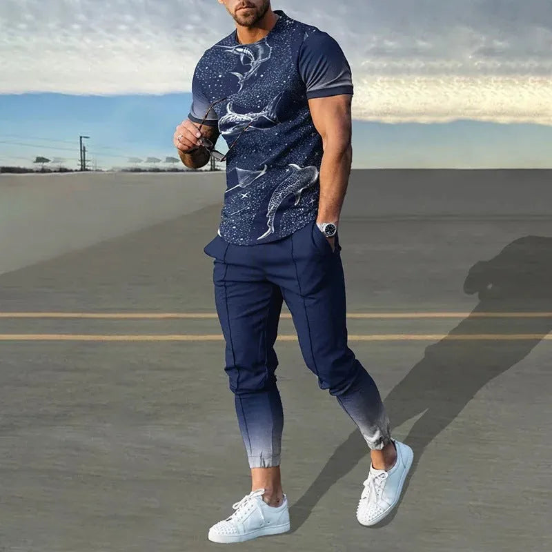 Men's grey printed short-sleeved tracksuit top and trousers laid flat.