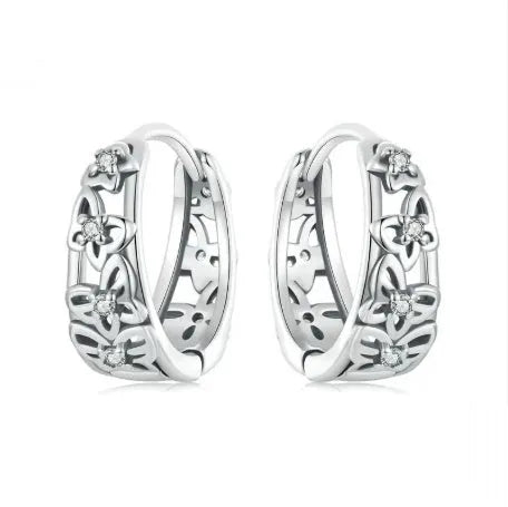 Retro hollow butterfly earrings in sterling silver with zircon accents, measuring 14mm by 5mm