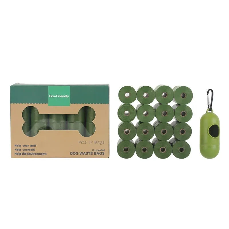 Roll of green EPI degradable pet garbage bags next to a boxed set with a dispenser.