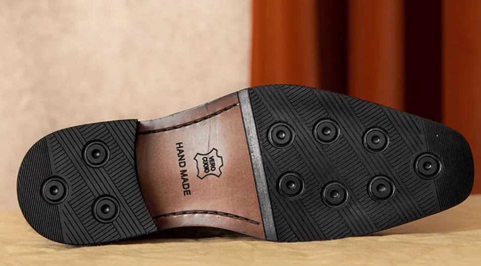 Men's black genuine leather loafers with fringed detail, rubber sole, and slip-on design