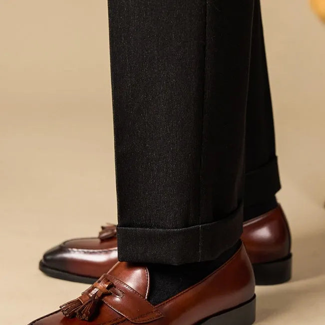 Men's polished leather tassel loafers in black and coffee colours with traditional British styling