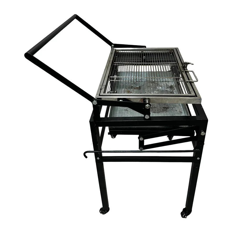 Large foldable charcoal BBQ grill with detachable parts in a garden setting