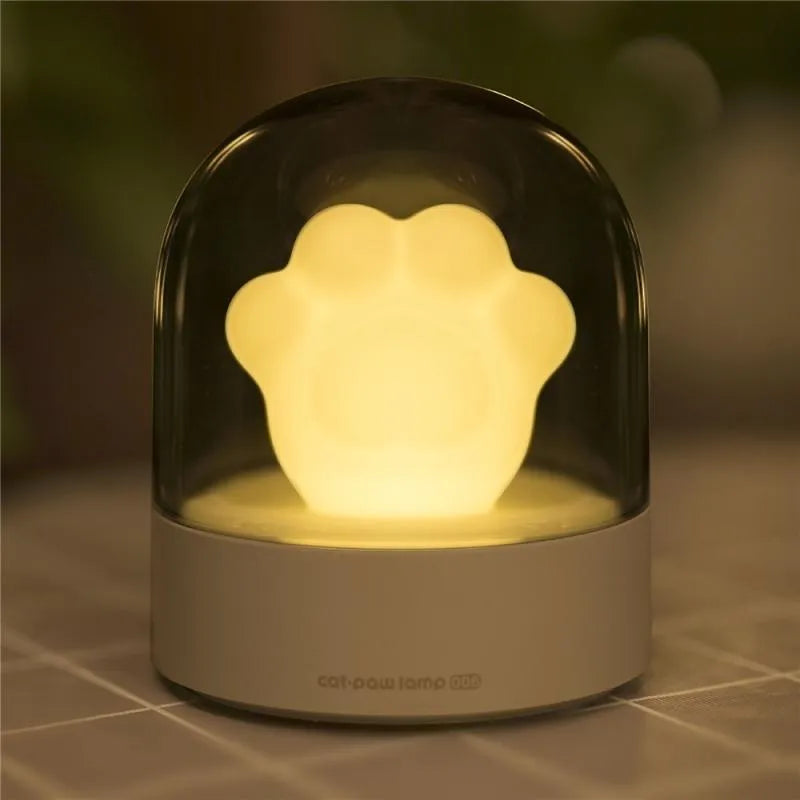 Grey cat paw shaped USB rechargeable night light with music box and rotating soft light