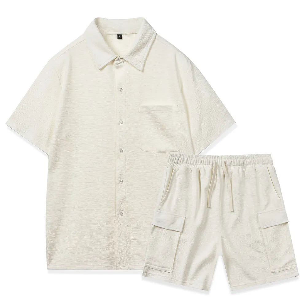 Beige polyester short-sleeve top and elastic waist shorts two-piece set laid flat.