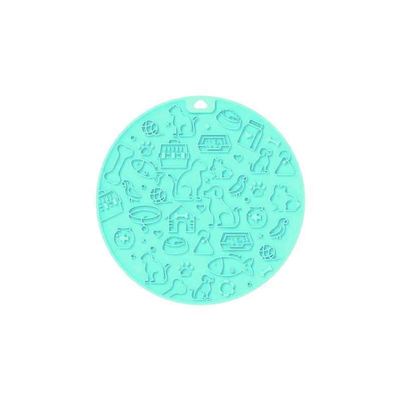 Round silicone pet licking mat with suction cup base in blue colour on a kitchen floor