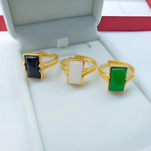 Adjustable brass gold-plated ring with an electroplated finish and a choice of black, green, or white gemstone.