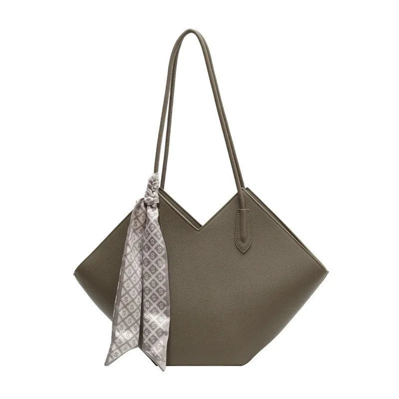 Women's large black PU leather shoulder bag with square shape showing exterior pocket and adjustable handle