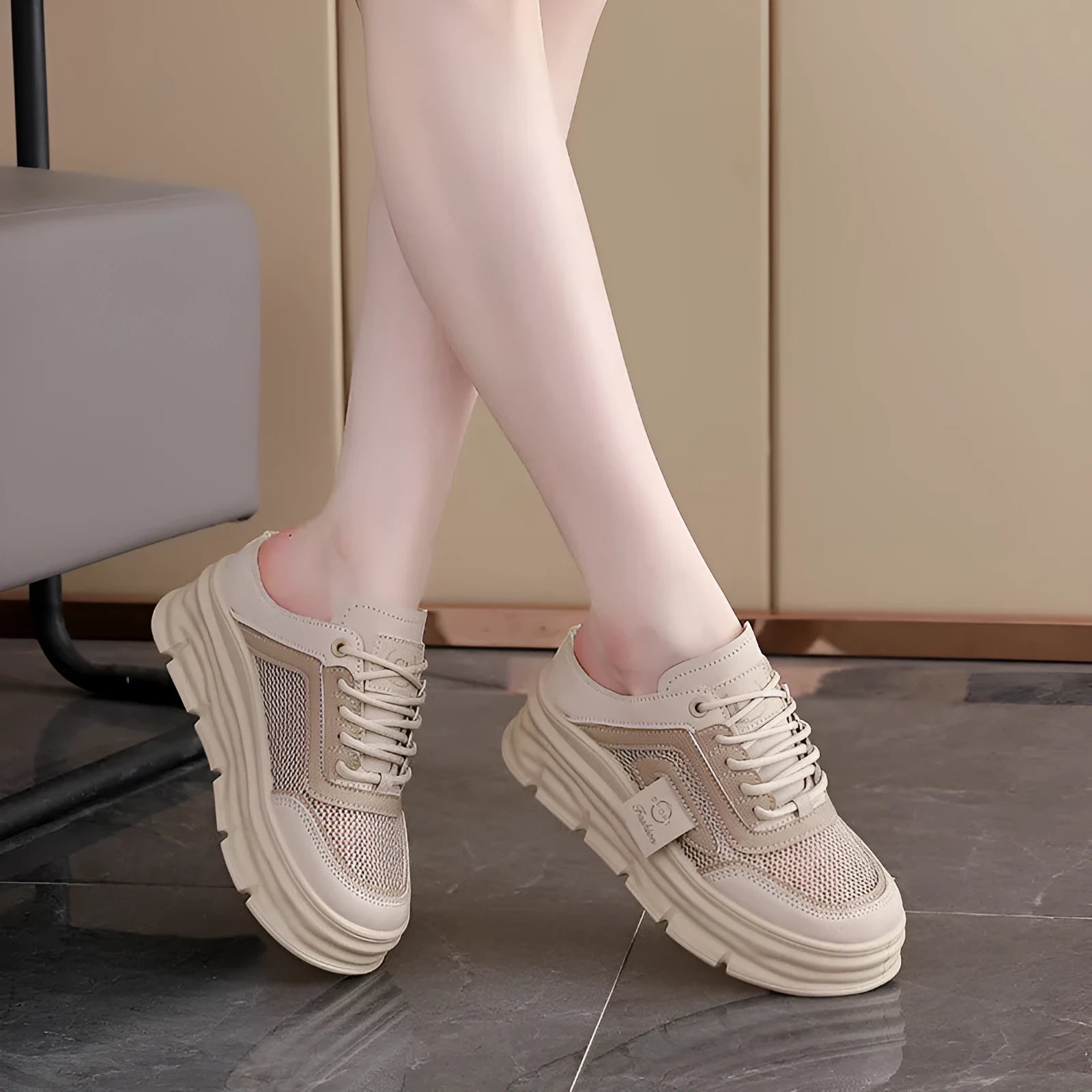 Women's black mesh half slipper with round toe, rubber sole, and height increase insole.