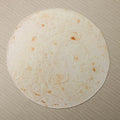 Round shape flannel burrito blanket with food-themed printing showing coral fleece texture