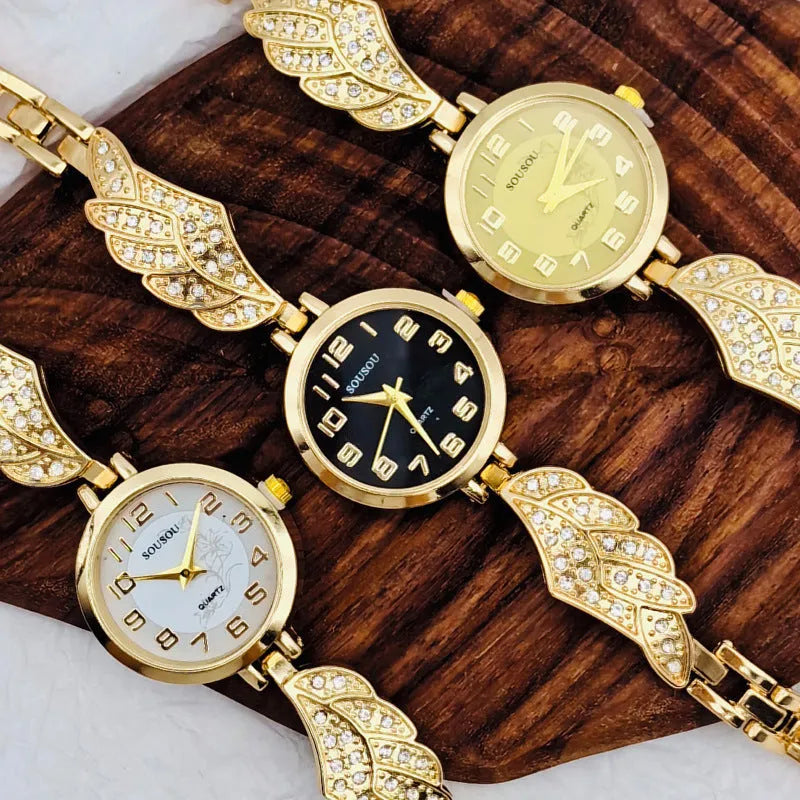 Stainless steel women's watch with round dial on wrist showing gold surface colour