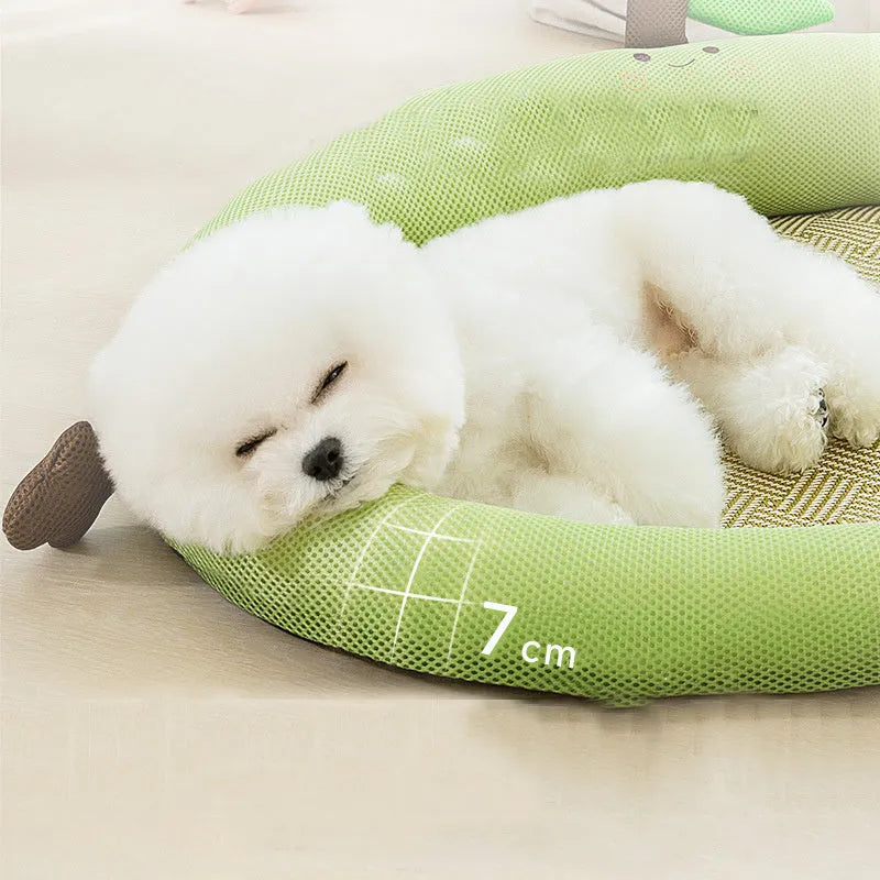Green fruit-shaped backrest pet cooling mat nest for dogs and cats on a wooden floor.