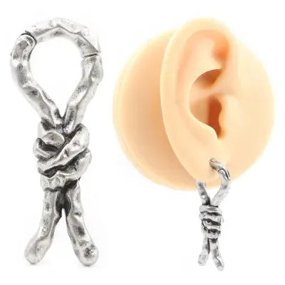 Close-up of copper retro earrings with a bending design for cartilage piercing.