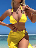 Rose red and yellow three-piece swimsuit bikini set with a mesh skirt laid flat.