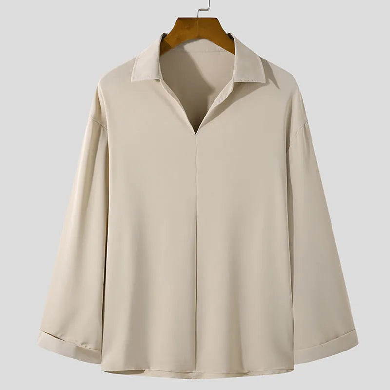 Men's loose fit long sleeve casual shirt in solid colour on a hanger.