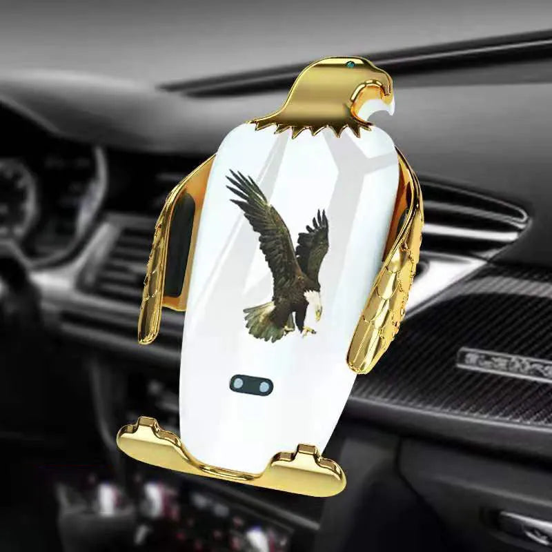 Car phone holder with wireless charging pad and Eagle design on a car dashboard.