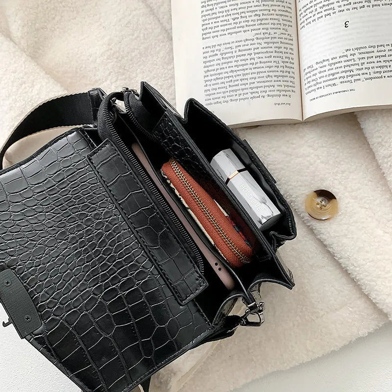 Vintage-style crossbody bag in PU leather shown in black, dark brown, khaki, or red