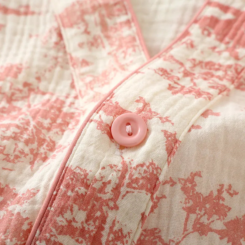 Women's pink cotton gauze lounge suit two-piece set with lace-up front trousers detail.