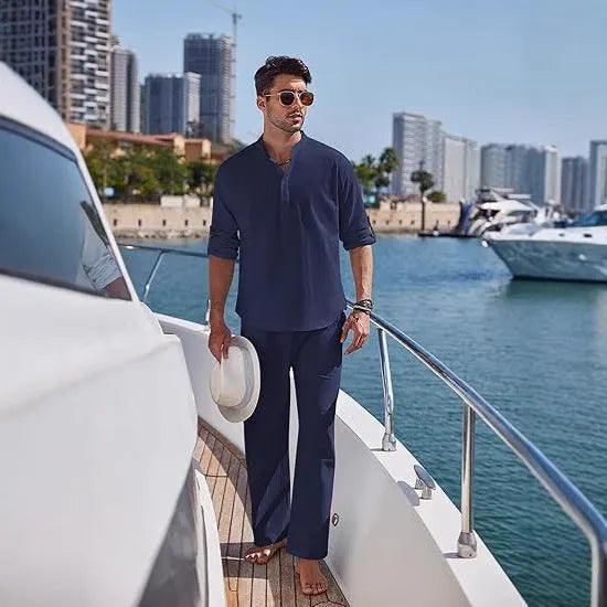 Man wearing a solid colour cotton long sleeve top and matching trousers from a casual suit.