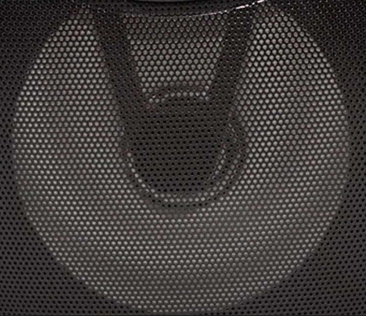 Black portable Bluetooth speaker with USB port and SD card slot on a table.
