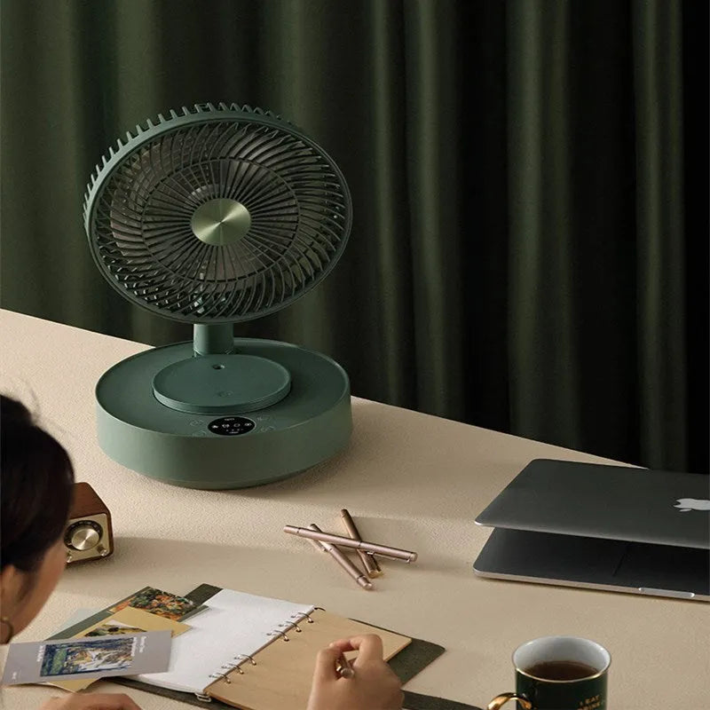 Green and white telescopic electric fan showing both desktop and extended floor-standing configurations